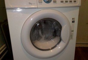hvordan du åpner maskinen mens du vasker