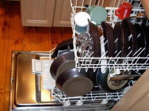 arranging dishes in the dishwasher