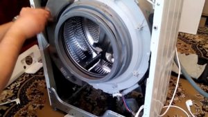 How to remove the front panel on an LG washing machine
