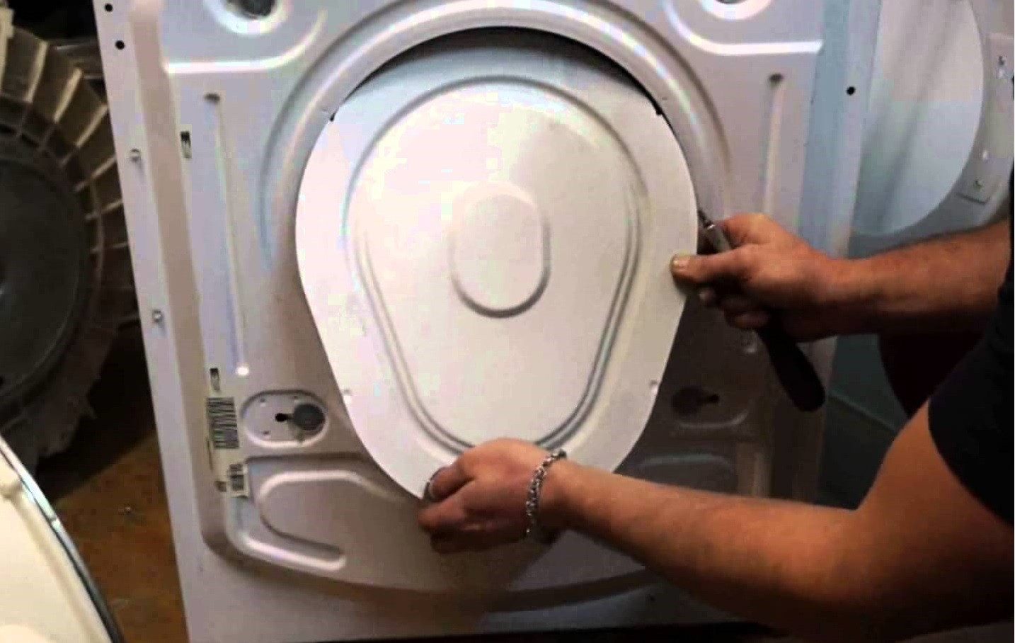 remove the back wall of the Kandy washing machine