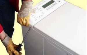 quitar el panel de la lavadora de carga superior