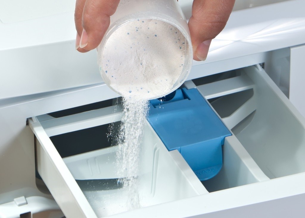 pour the powder into the largest compartment