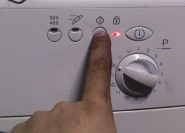 How to reset a program on an Indesit washing machine