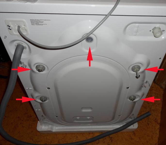 How to remove the transport bolts on an Indesit washing machine