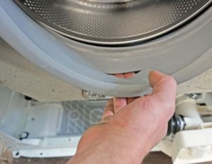 Hoe vervang ik de manchet van een Beko-wasmachine?