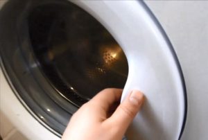 כיצד לפתוח את דלת מכונת הכביסה Kandy אם הידית שבורה?