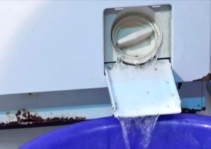 How to drain water from a Zanussi washing machine?