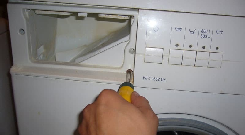 unscrew the screws near the powder receptacle