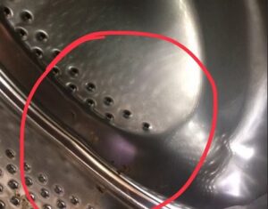 Hole in the washing machine drum