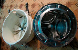 Paano alisin ang drum mula sa washing machine tub