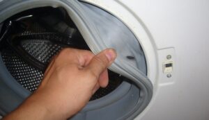 Hoe de manchet in een Candy-wasmachine vervangen?