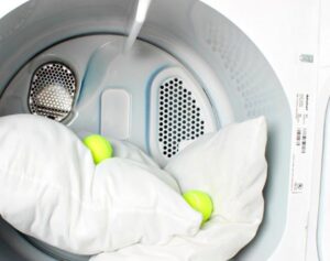 Can you dry a feather pillow in a dryer?