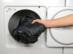 What program should I use to dry a down jacket in a dryer?