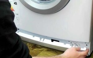 Paano alisin ang ilalim na panel ng isang LG washing machine