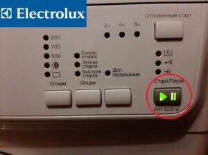 The start button flashes green on an Electrolux washing machine