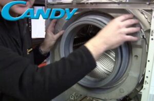 Hur man tar bort frontpanelen på en Candy-tvättmaskin